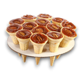 Dulceria 915 Cono de Cajeta individual dessert cones topped with caramel and pecans.