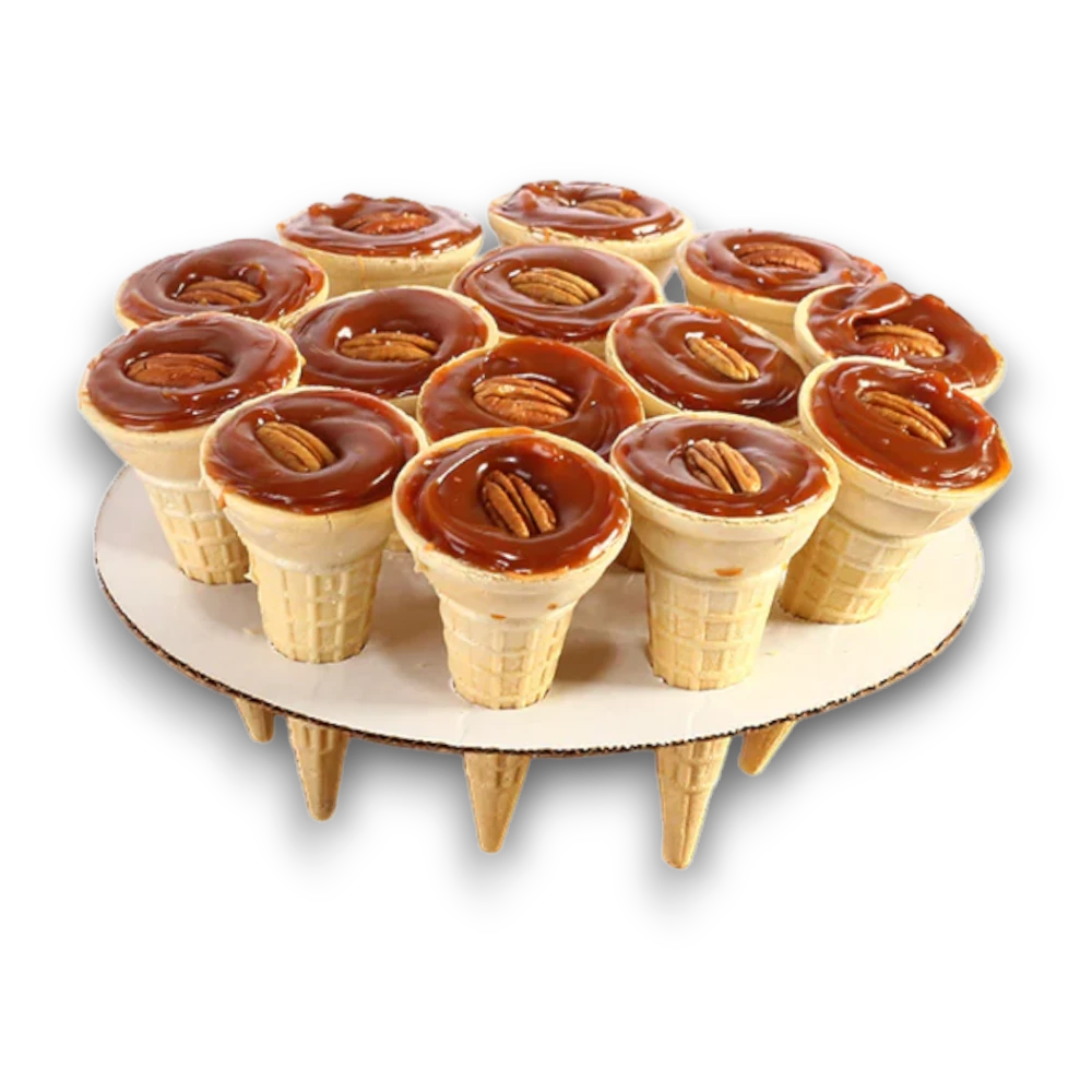Dulceria 915 Cono de Cajeta individual dessert cones topped with caramel and pecans.