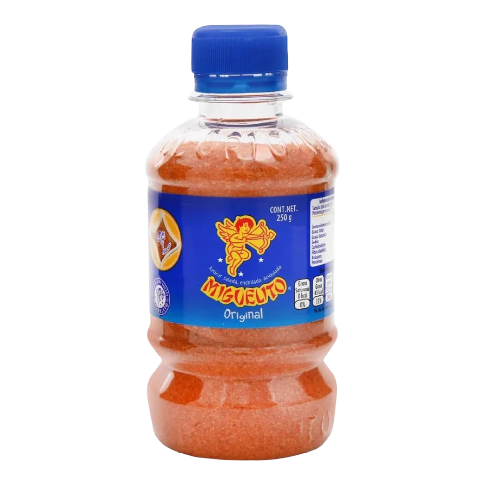 Dulceria 915 Miguelito Original chili powder in a clear plastic bottle with a blue cap. The powder is orange-red.