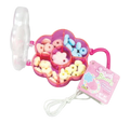 Dulceria 915 Sweet Beads candy jewelry kit in a pink flower-shaped container with pastel beads and string.